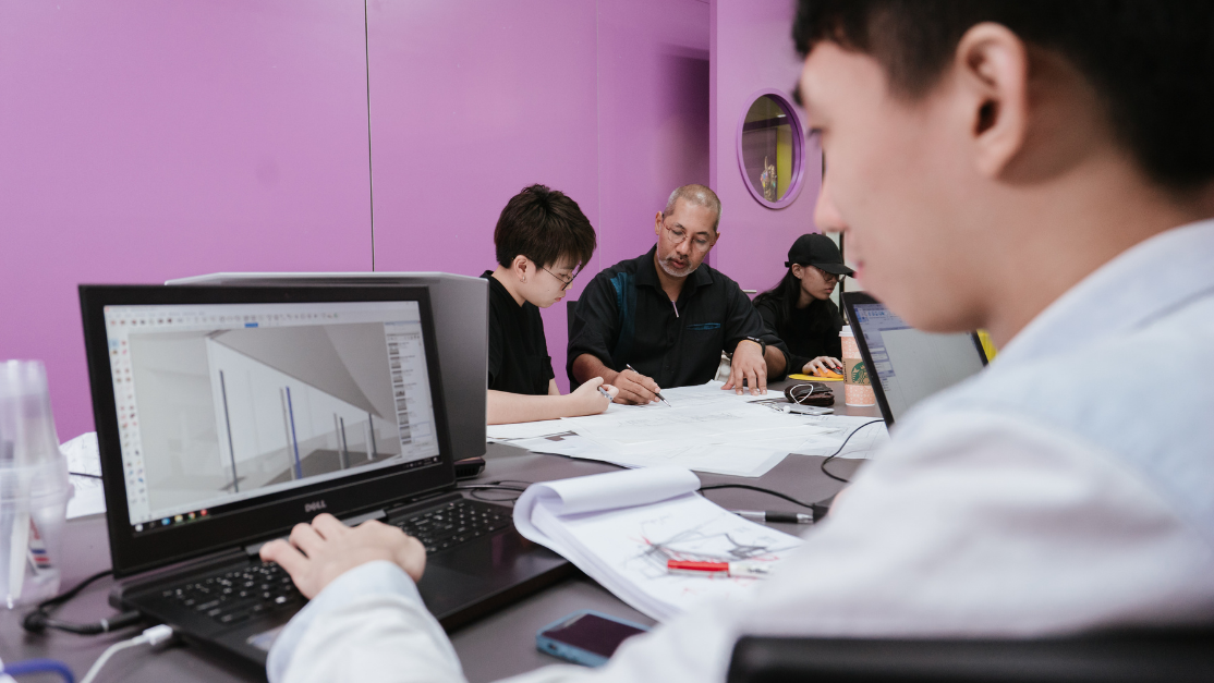 student using a laptop to work on a simulation