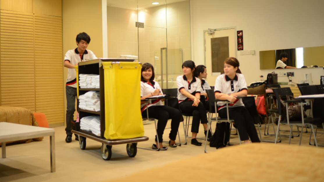 mock hotel room housekeeping setting