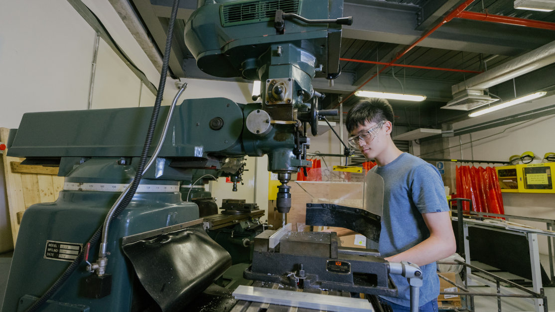student using a manufacturing device