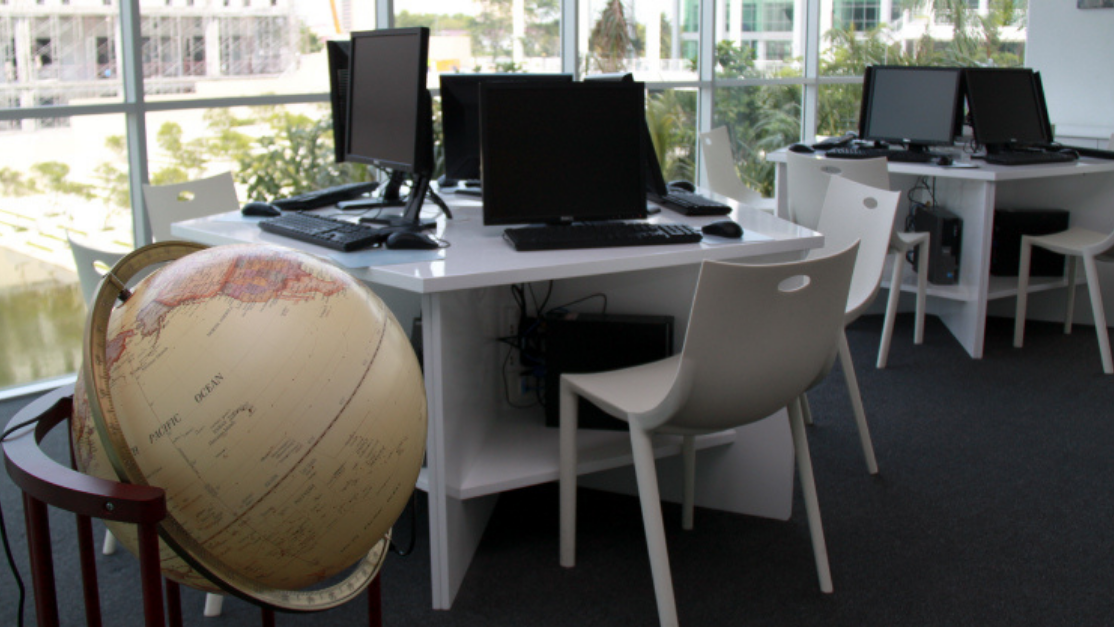 globe next to a computer desk
