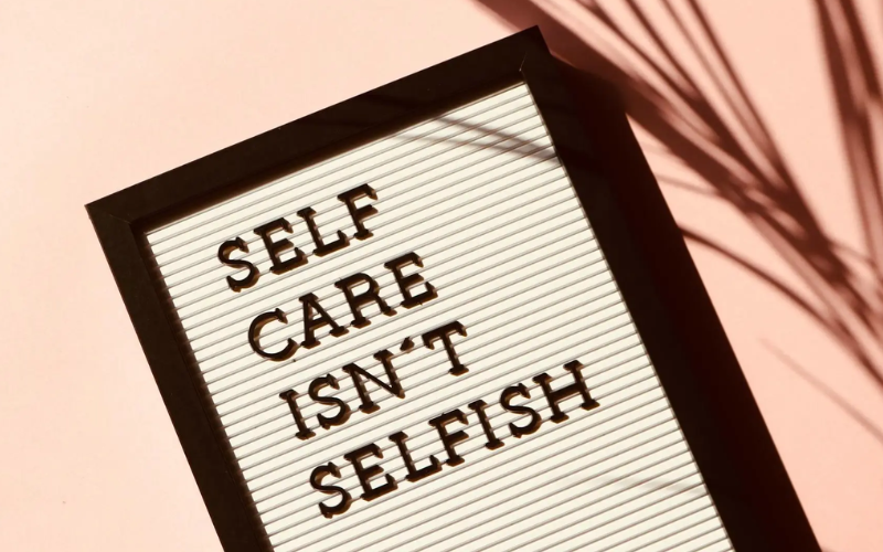 A sign saying "Self care isn't selfish"