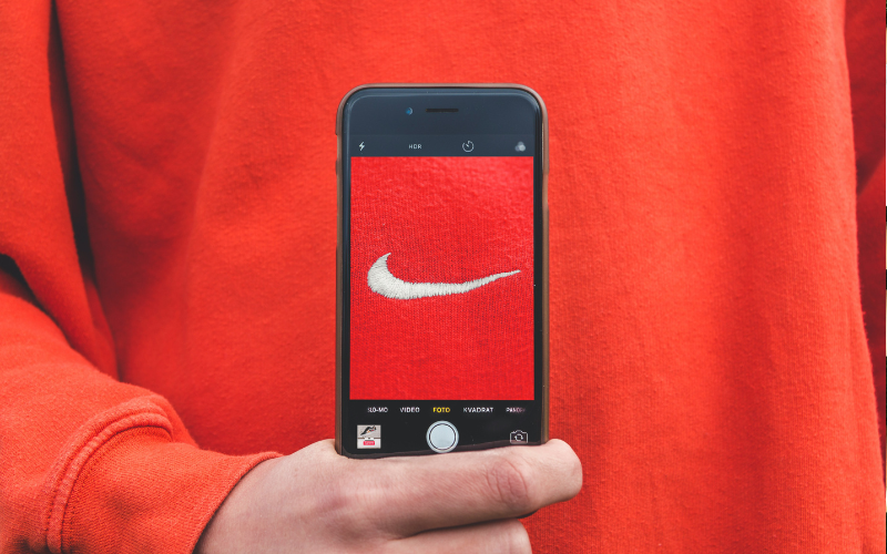 Picture of someone wearing a red colour Nike shirt