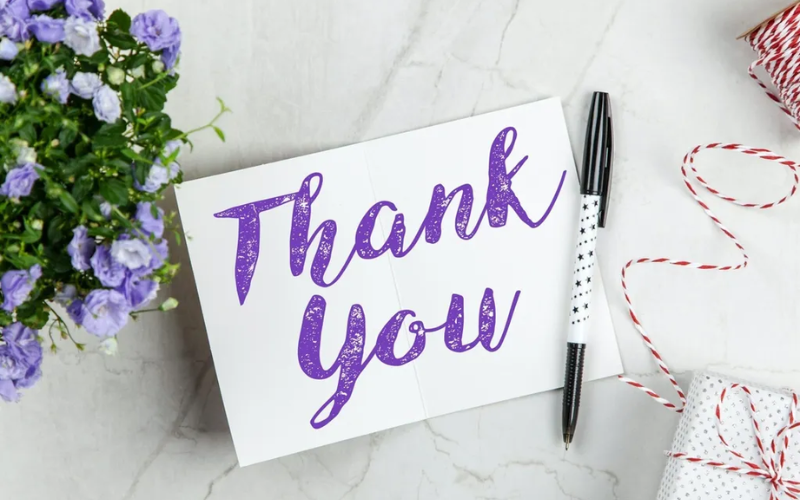 thank you note and a pen