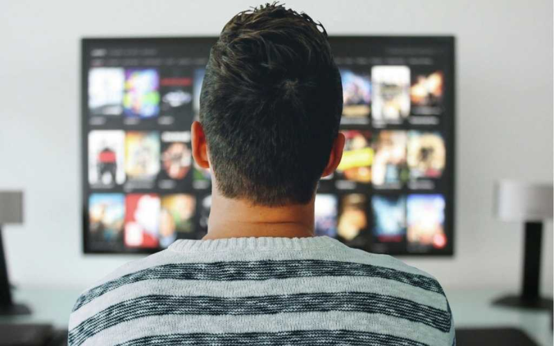 A guy is watching television