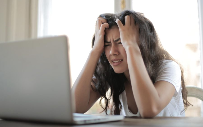 woman stressed at a laptop