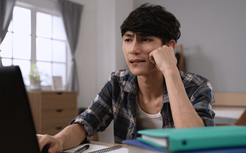 Man looking confused at the laptop