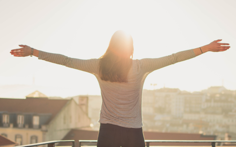 A girl is exposing herself to sunlight