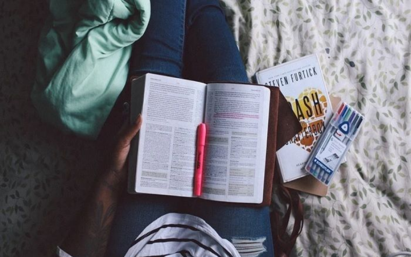 A guy is reading a book