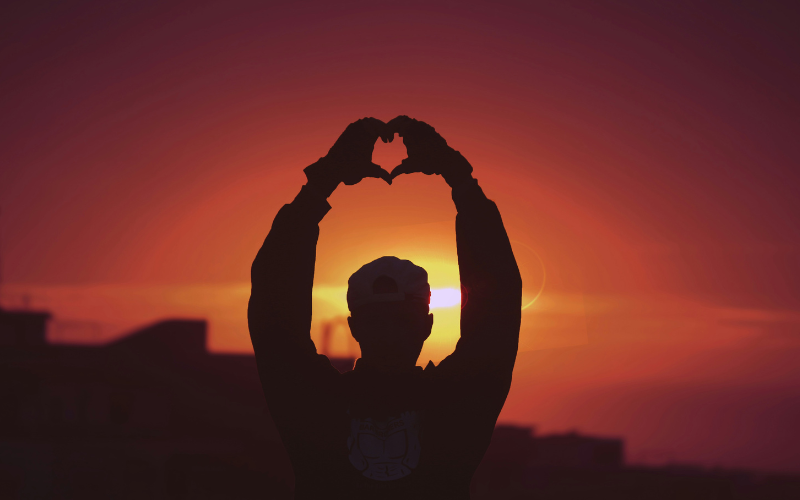 Man showing a heart with his hands 