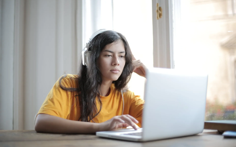 Woman looking at laptop