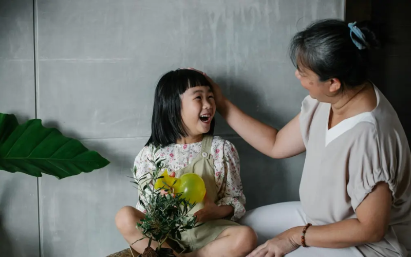 parent patting on child's head