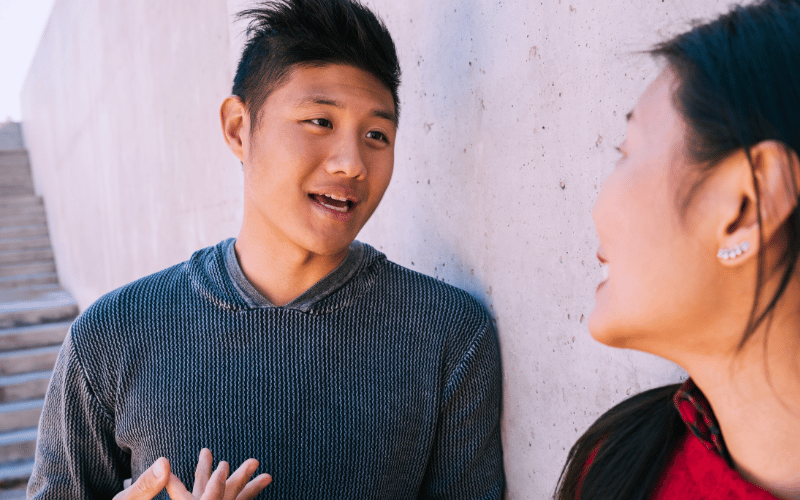 Man talking to woman