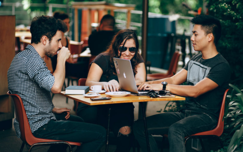 three friends at a cafe