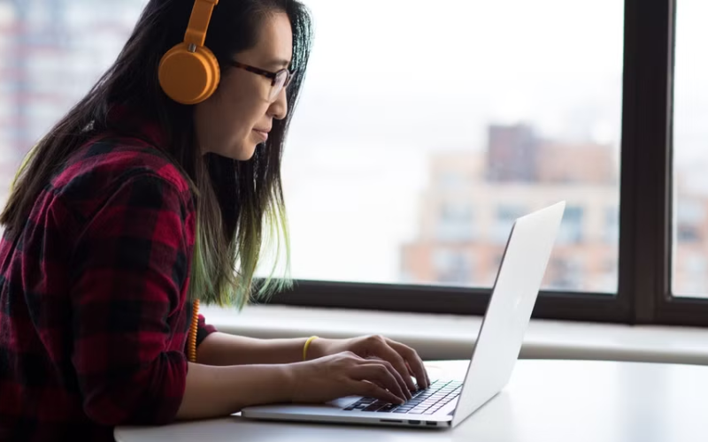 Woman looking at laptop