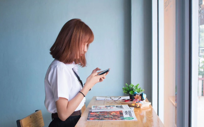 A girl is playing phone