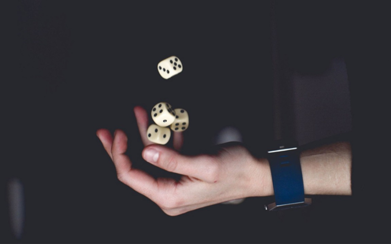 Hand throwing 4 dices