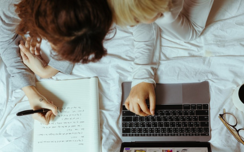 Writing notes on a bed