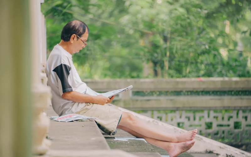 Man reading newspaper