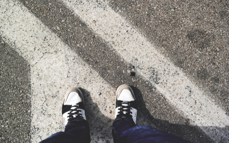 a pair of shoes at a crosswalk