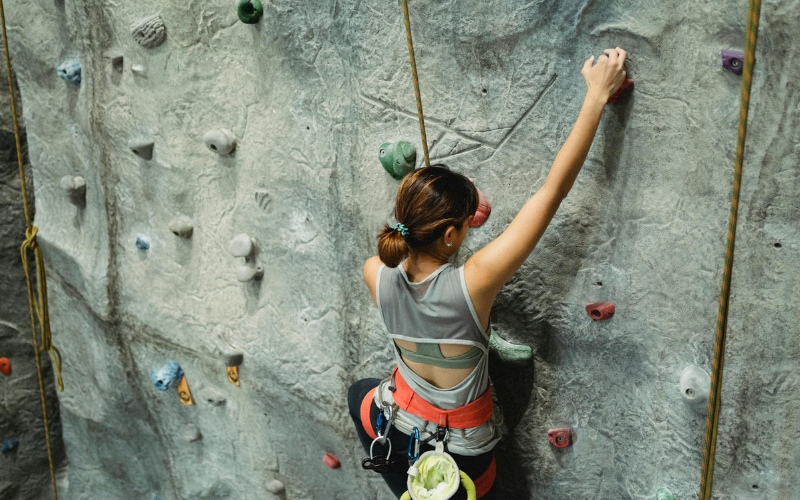 women rock climbing