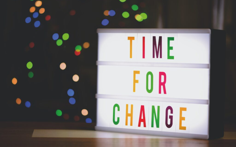 board with the words "TIME FOR CHANGE"