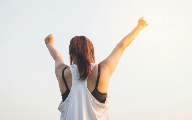 Women with her hands raised