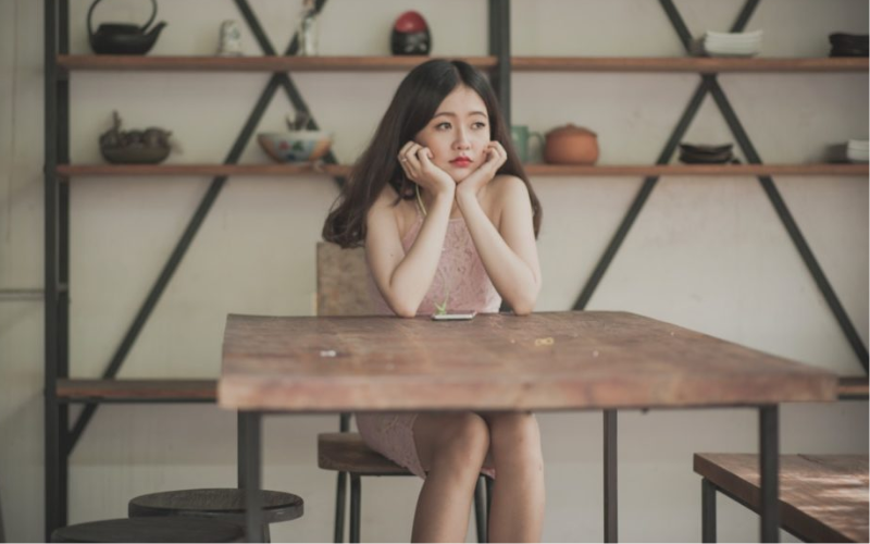 women sitting on a table waiting