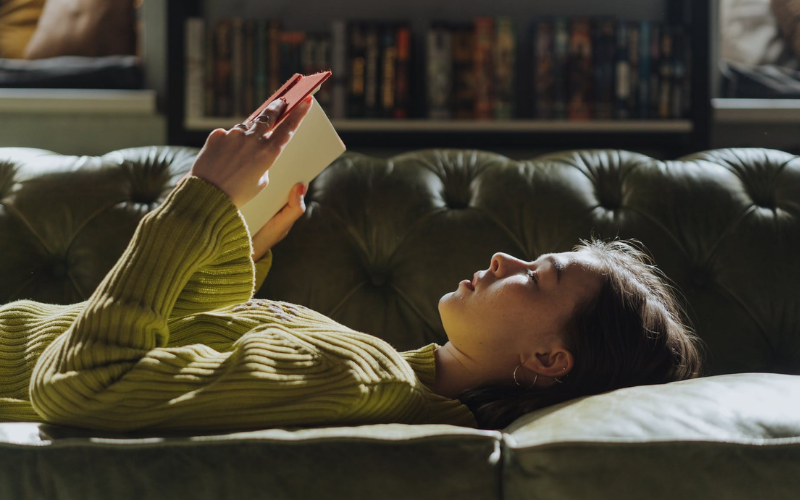 Woman laying down and reading