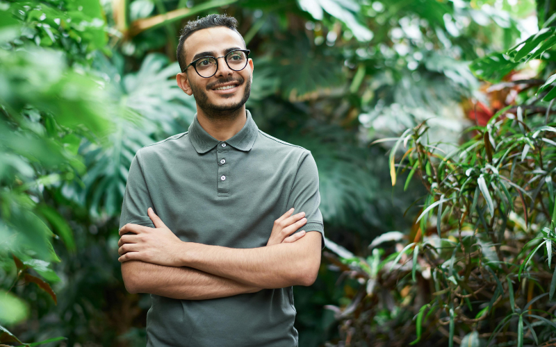 A boy with glasses in the jungle