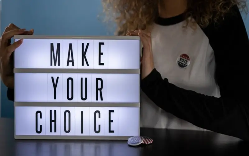 LED light box displaying words "Make Your Choice"