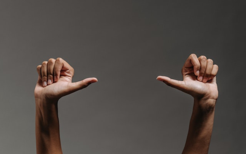 Opposite direction of thumbs up 