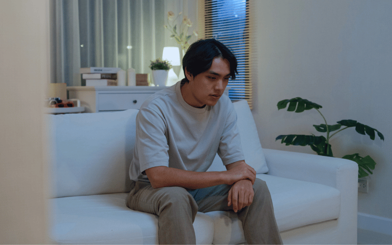 A man sitting alone contemplating