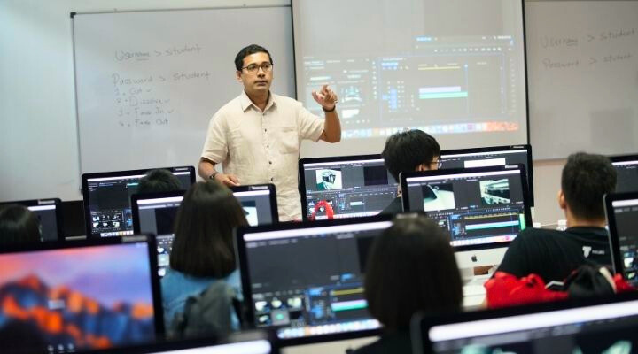 Mr. Justin Lopez teaching in his class