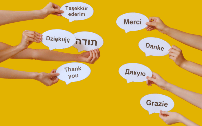 different international language of "thank you" printed on cutout dialogue shapes