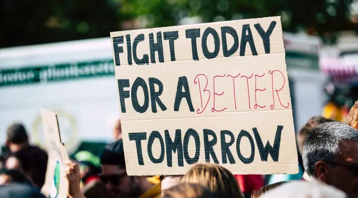 A placard that writes Fight Today For A Better Tomorrow