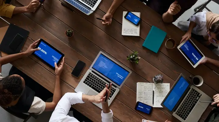 bird's eye view of people with their laptops