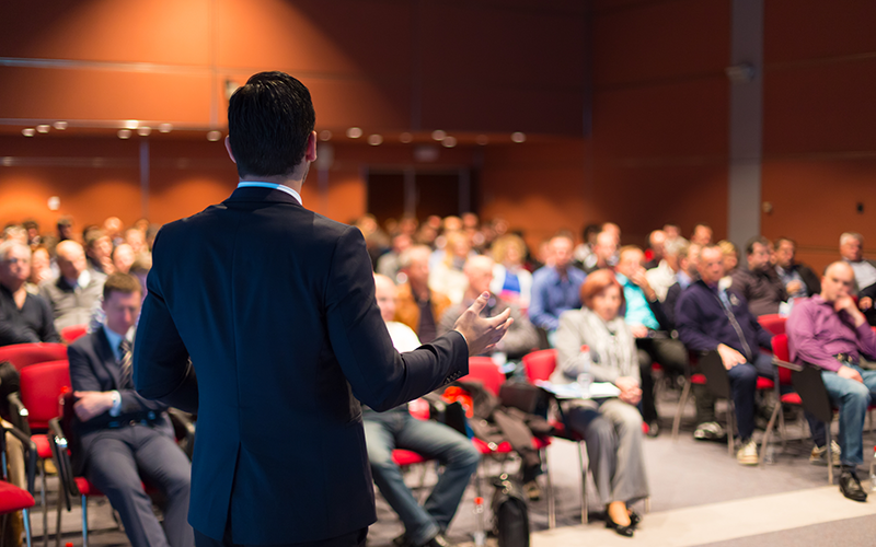 Male speaker giving a talk