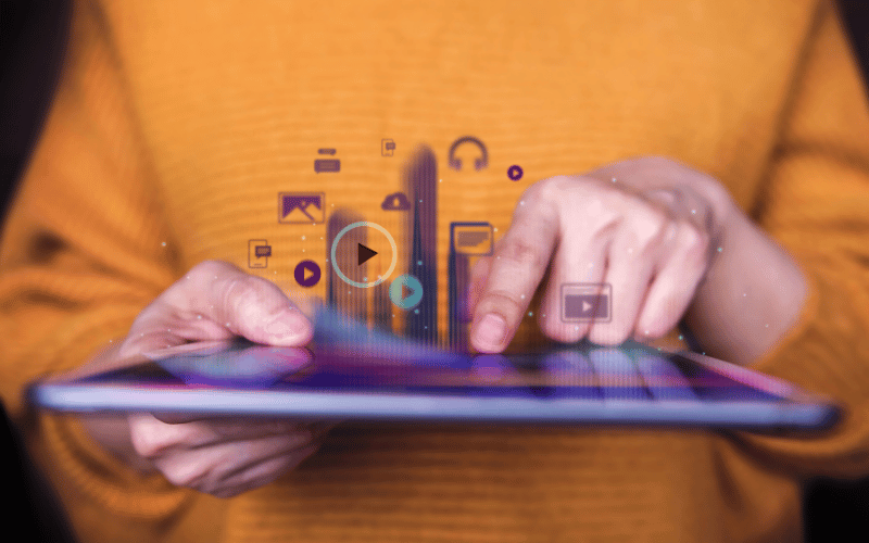 A woman holding a tablet that projects worldwide internet connectivity