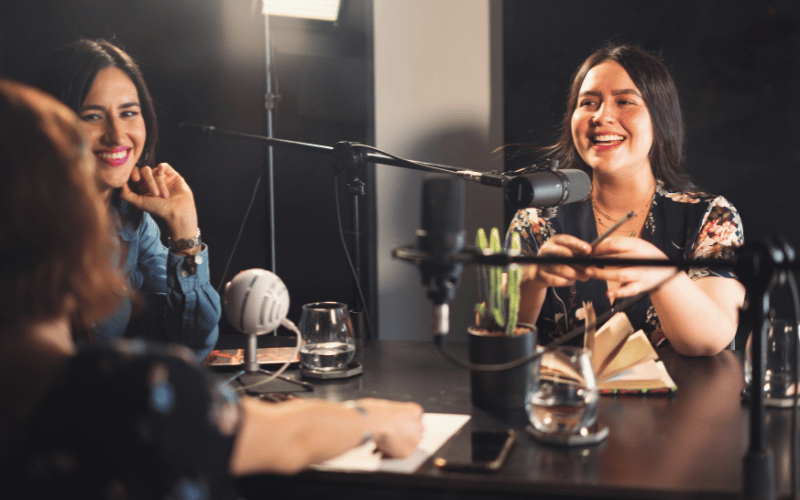 three ladies participate in a podcast show