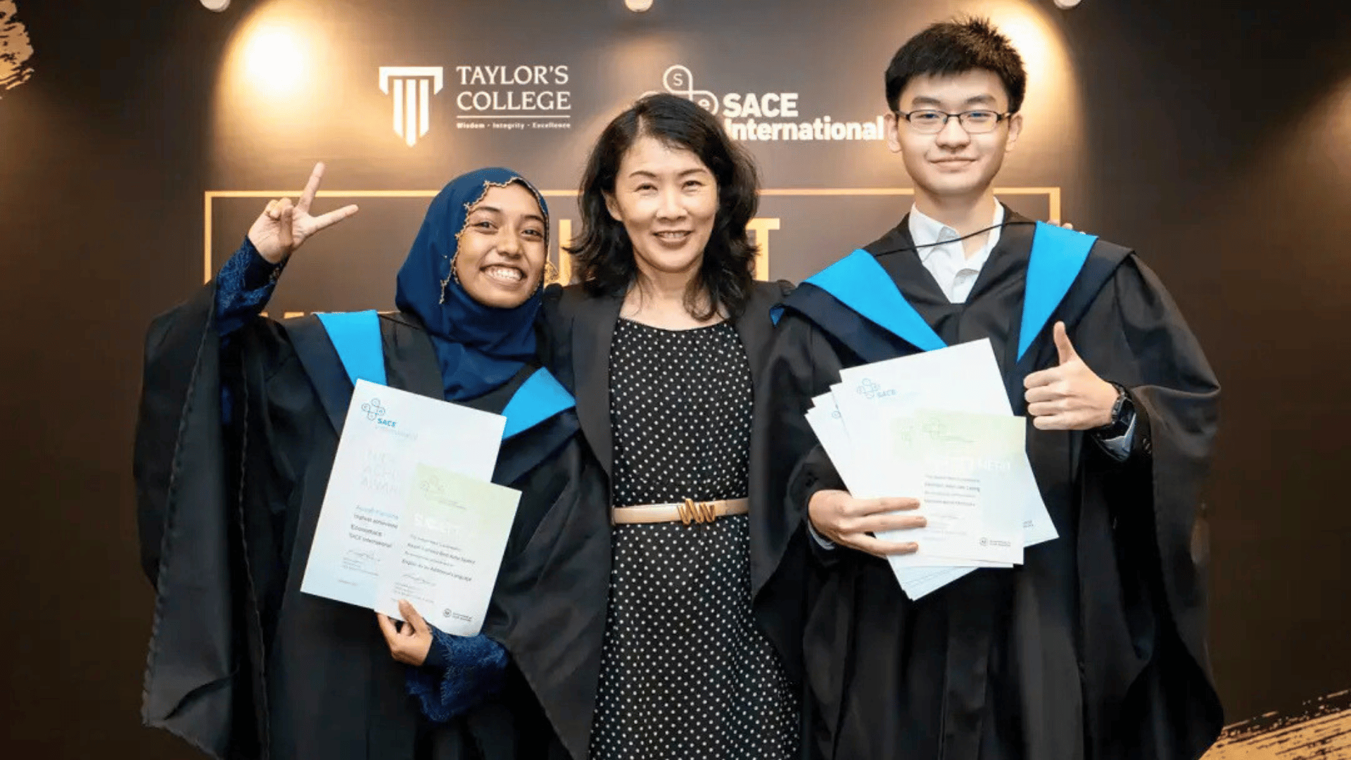 Aisyah and Matthew pose with Tiew Ai Ben