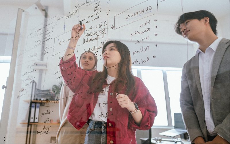 Gen Z youth mapping out strategy on transparent screen