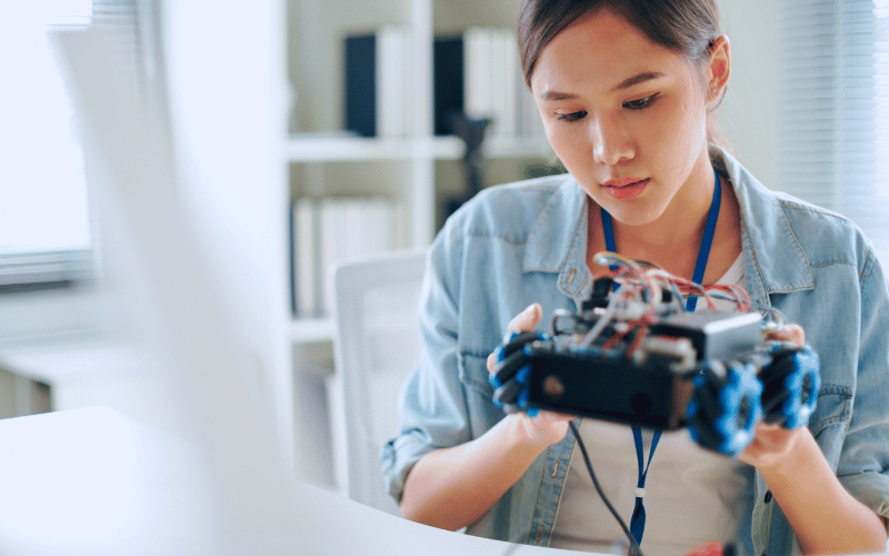 Lady working on a robotic car