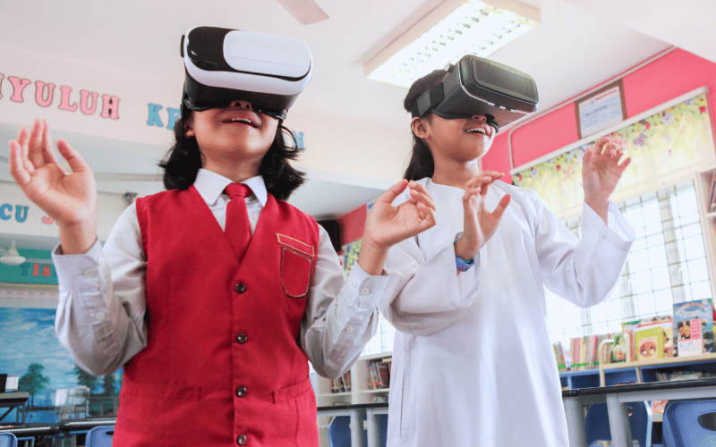 Two students in their VR goggles shows mesmerisation