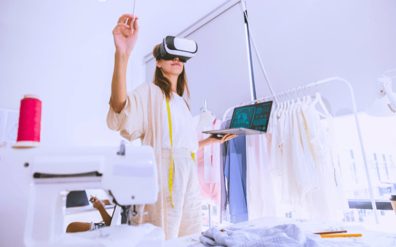 Lady wears XR headset in her fashion studio designing virtually
