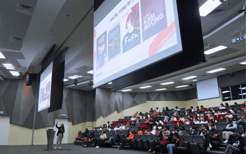 Female speaker educate students with insights about social advocacy