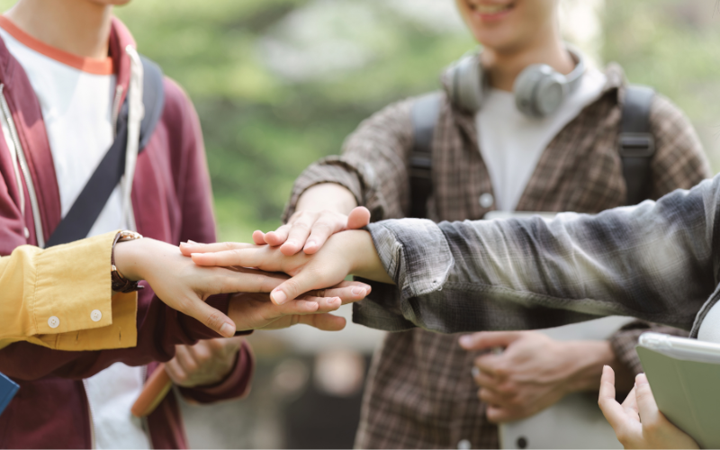 Students joining hands