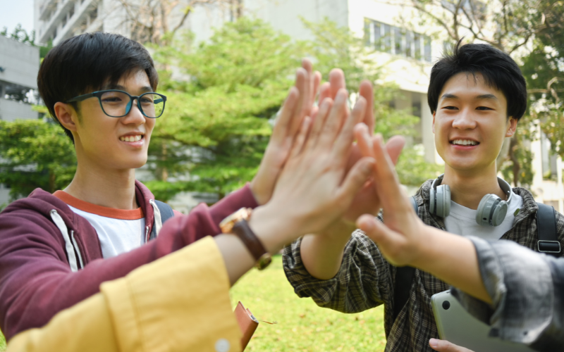 Students giving each other a high-five