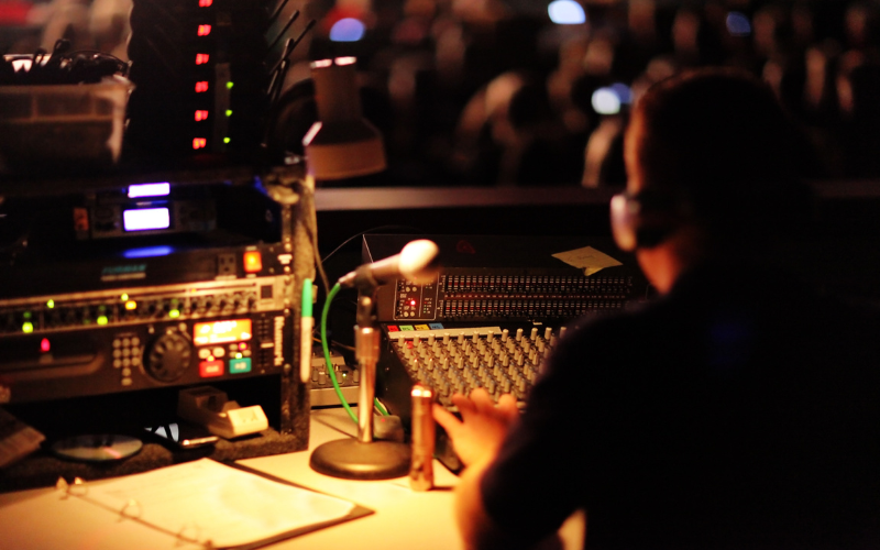 Sound engineer in control booth