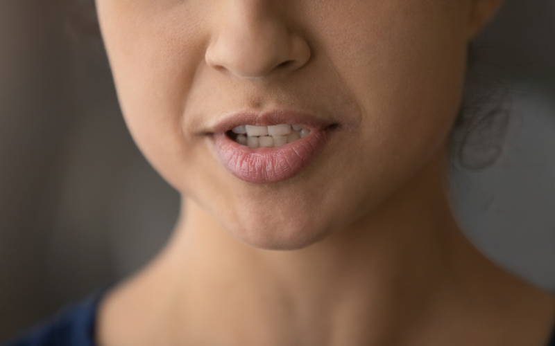 A close-up of a woman’s lips while speaking