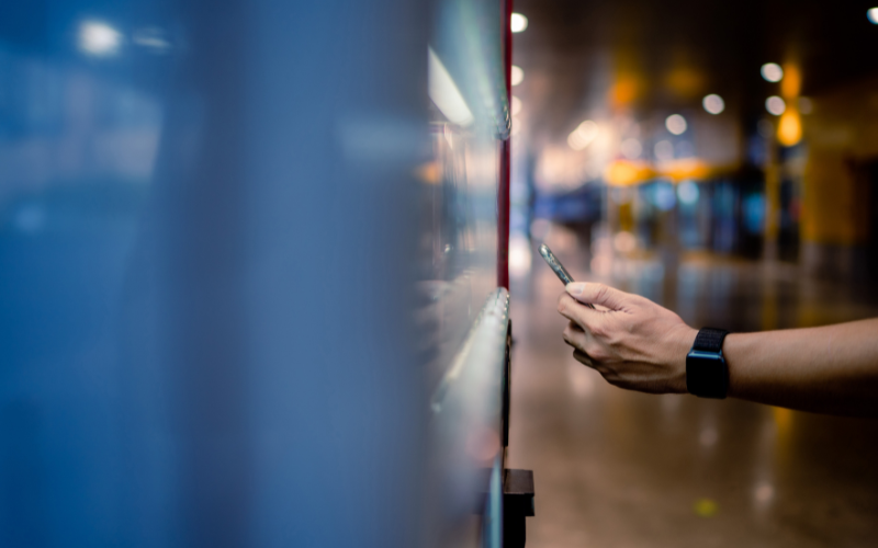 A person uses a vending machine